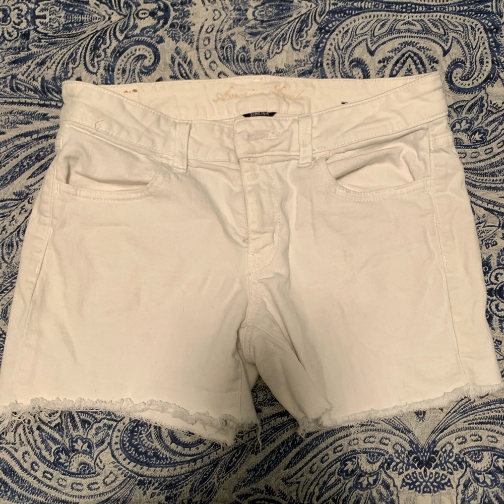 AE White stretch jegging cut off shorts